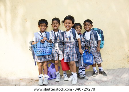 AMRAVATI, INDIA - October 10, 2015:  Happy small children dressed With bag in kindergarten, Amravati , Maharashtra, India