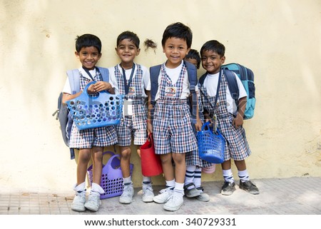 AMRAVATI, INDIA - October 10, 2015:  Happy small children dressed With bag in kindergarten, Amravati , Maharashtra, India