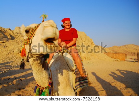 http://image.shutterstock.com/display_pic_with_logo/68798/68798,1196783329,1/stock-photo-girl-on-a-funny-camel-eastern-sahara-in-egypt-7526158.jpg