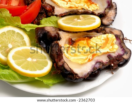 Greek see food dish with tomatoes and lemon