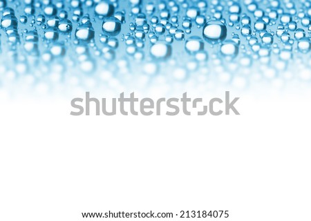 Abstract Border of Blue Water Drops - soft focus on the center, copy space for text