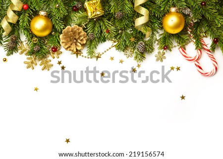 Christmas tree branches with golden baubles, stars, snowflakes isolated on white - horizontal border
