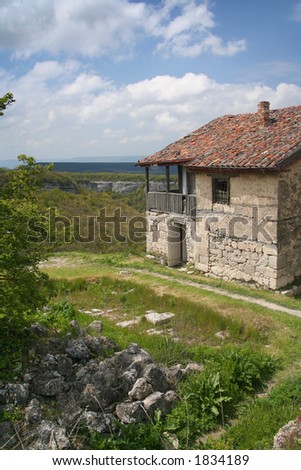 Ancient stone hut. Is highly in mountains. Earlier people here lived. Now there come the tourists.