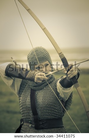 stock photo : bows woman / medieval armor / historical story  / retro split toned
