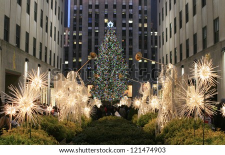 NEW YORK CITY - DEC. 8, 2012: New York City landmark, The famous Rockefeller Center Christmas tree viewed from the Channel Gardens, Dec. 8, 2012, celebrating the 80th anniversary of the tradition.