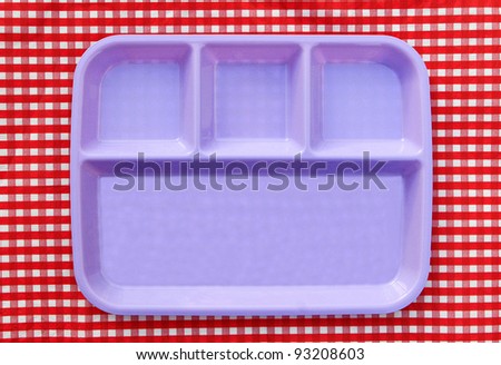 Purple School Lunch Serving Tray / Plate isolated on red and white checkered background