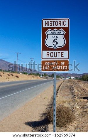 Metal road sign designates the path of Historic Route 6 through southern California.