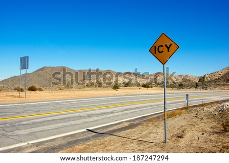 Warning of ice on a road in the desert of southern California\'s Mojave Desert.
