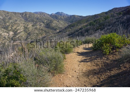 Dirt trail leads into the mountains of Angeles National Forest in southern California.