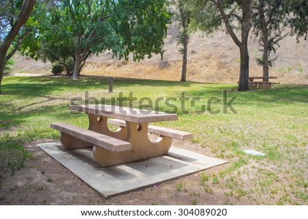 Cement picnic table sitting on a pad in Val Verde, California.
