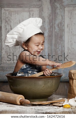 Little Chef.  Adorable baby boy dressed in s chef\'s hat.