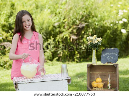 Lemonade Stand.  Young girl selling lemonade.