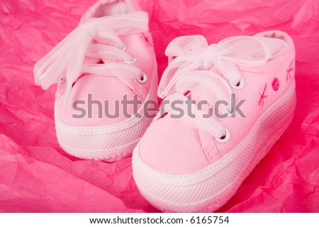 Sexy Baby on Pink Baby Sneakers On Hot Pink Gift Wrapping Paper  Stock Photo
