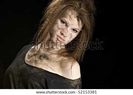Beautiful young woman covered in mud!