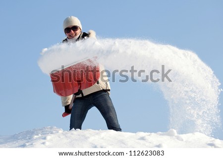 woman shovelling snow