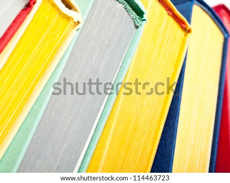 Collection of multicolored books - closeup shot, books background