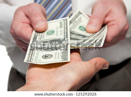 Human hands exchanging money - closeup shot