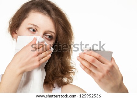 Woman having allergy and selects drug; isolated on white background
