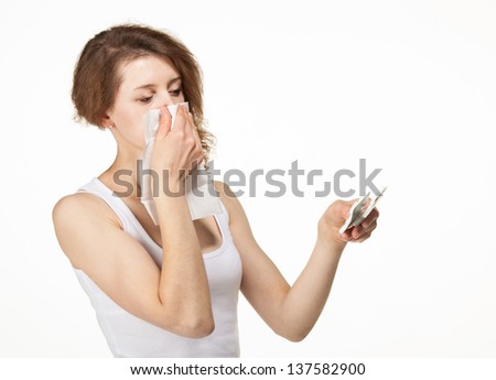 Woman having allergy and selects drug; white background