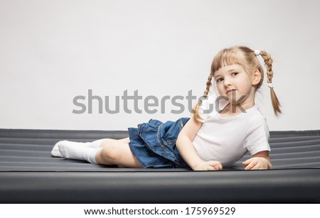 Portrait of a little girl lying on the air-bed