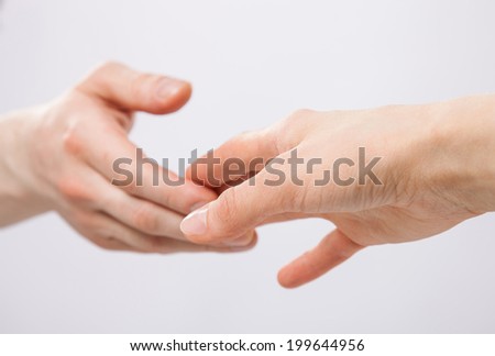 Gentle touch of man and woman hands