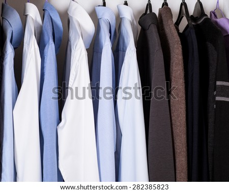 Official strict male clothes in a built-in closet