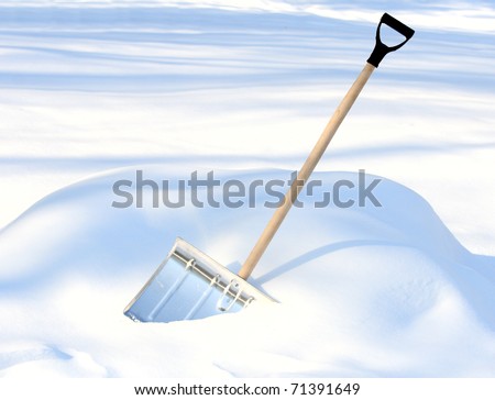 Shoveling snow from driveway: shovel in snow