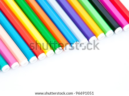 Diagonal fragment of colorful markers; white background