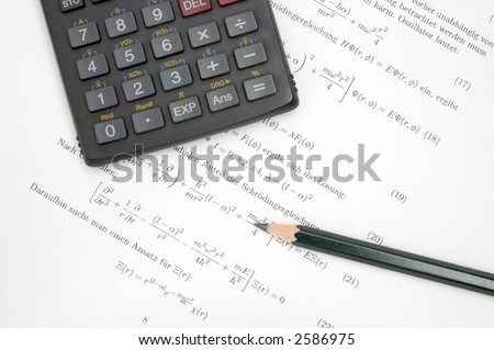 Still life of an calculator and a pencil on scientific paper