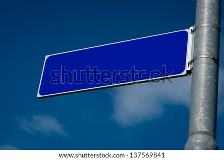 Blank Road Sign with sky and clouds.