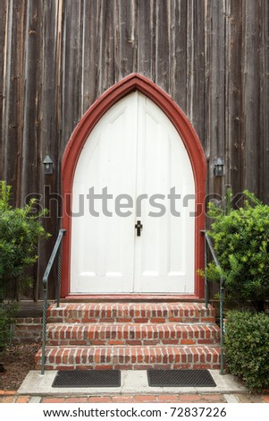 Simple Gothic church door cross shaped door knob plate.