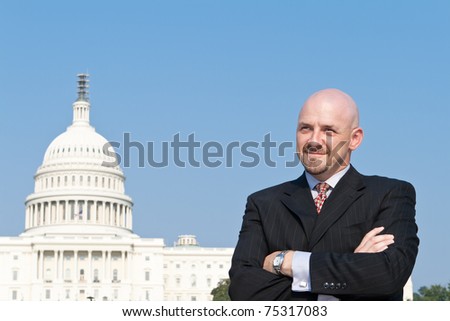 Smiling white man looking at the camera.  He\'s a lobbyist standing outside the U.S. Capitol in Washington DC, United States.