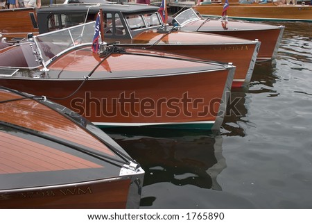 Bow of Four Antique Wooden Boats Abreast - stock photo