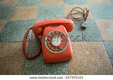 Vintage phone isolated on a floor background.