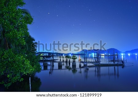 Peaceful night with boats and star