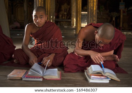 Yangon - Myanmar - December 4, 2012: An Unidentified Praying Buddhist Novice On December 4, 2012 In Yangon, Myanmar. In 2012 An Ongoing Conflict Started Between Buddhists And Muslims In Myanmar.