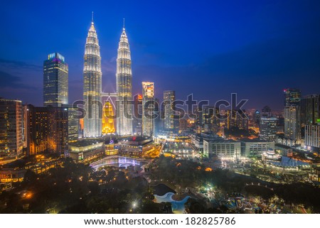 KUALA LUMPUR - FEB 12: The Petronas Twin Towers on February 12, 2014, in Kuala Lumpur, Malaysia are the world\'s tallest twin tower. The skyscraper height is 451.9m