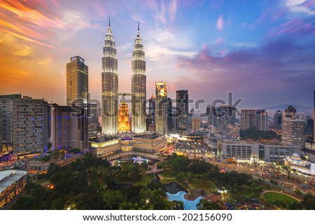 KUALA LUMPUR - FEB 12: The Petronas Twin Towers on February 12, 2014, in Kuala Lumpur, Malaysia are the world\'s tallest twin tower. The skyscraper height is 451.9m