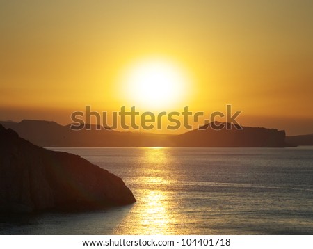 Sun glow at sunset. Bright seascape