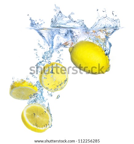 Parts and whole lemon under water. Healthy and tasty food