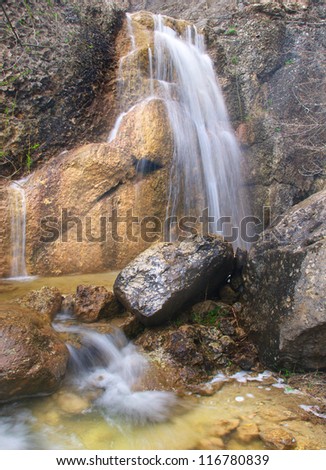 Waterfalls and large stones. Natural composition
