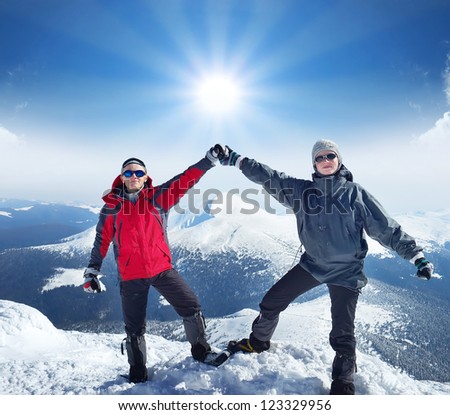 Couple of climbers on the mountain top. Sport and active life