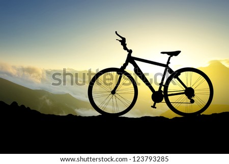 Bike silhouette on background of sundown. Sport and active life