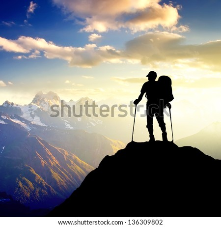 Silhouette Of A Champion On The High Mountain. Sport And Active Life