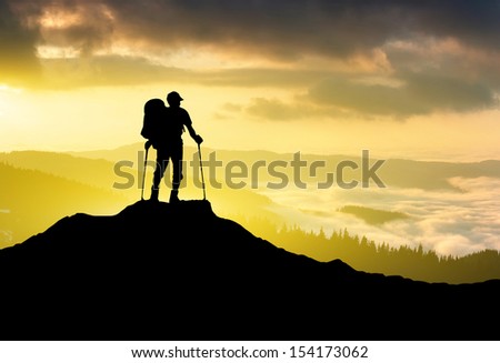 Tourist silhouette on the sun glow background. Sport and active life concept