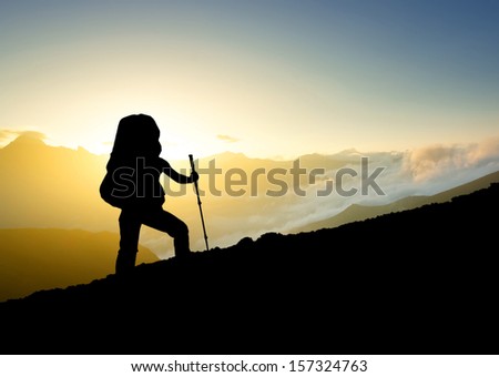 Tourist on the mountain top. Sport and active life concept