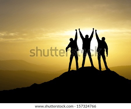 Winners team on the mountain top Sport and active life concept Winners team on the mountain top Sport and active life concept