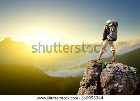 Tourist on the mountain top. Sport and active life concept