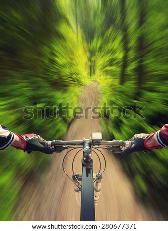 Fast ride in summer forest. Sport and active life concept