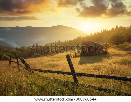Sun beam in mountain valley in the morning time during sunrise. Natural summer landscape